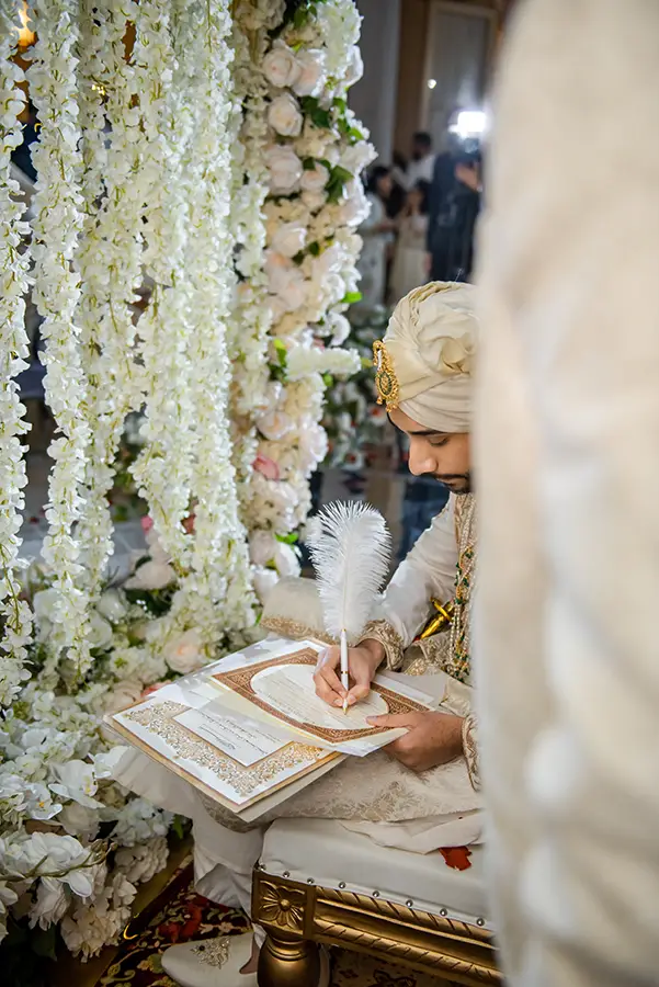 Handsome Indian Groom Signing Marriage Certificate