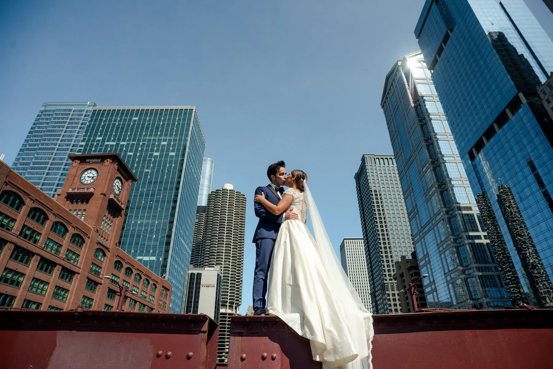 Bride and groom kissing at the bridge Chicago