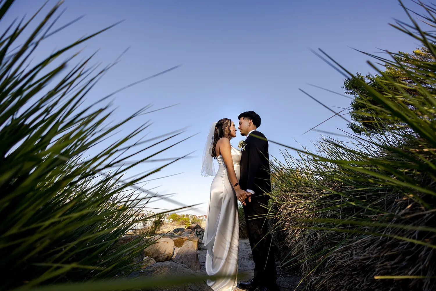 Wedding couple facing each other in the Shoreline Park during the sunset Long Beach Wedding Photogrpaher