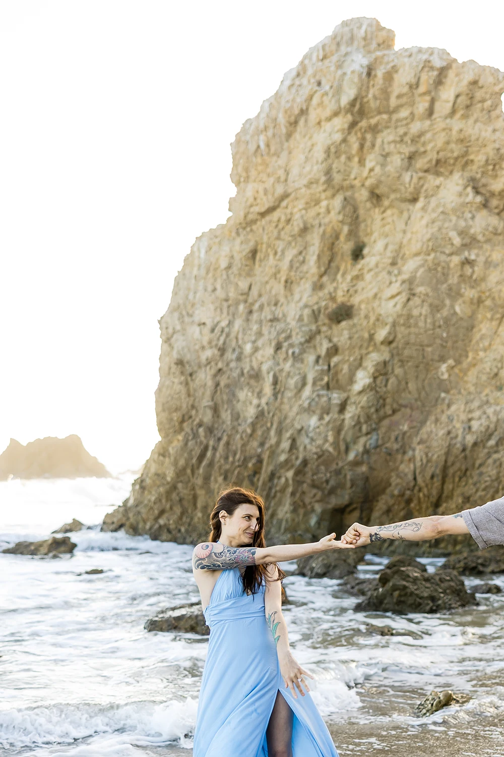 Couple dancing at the beach at El Matador Beach, Malibu, California