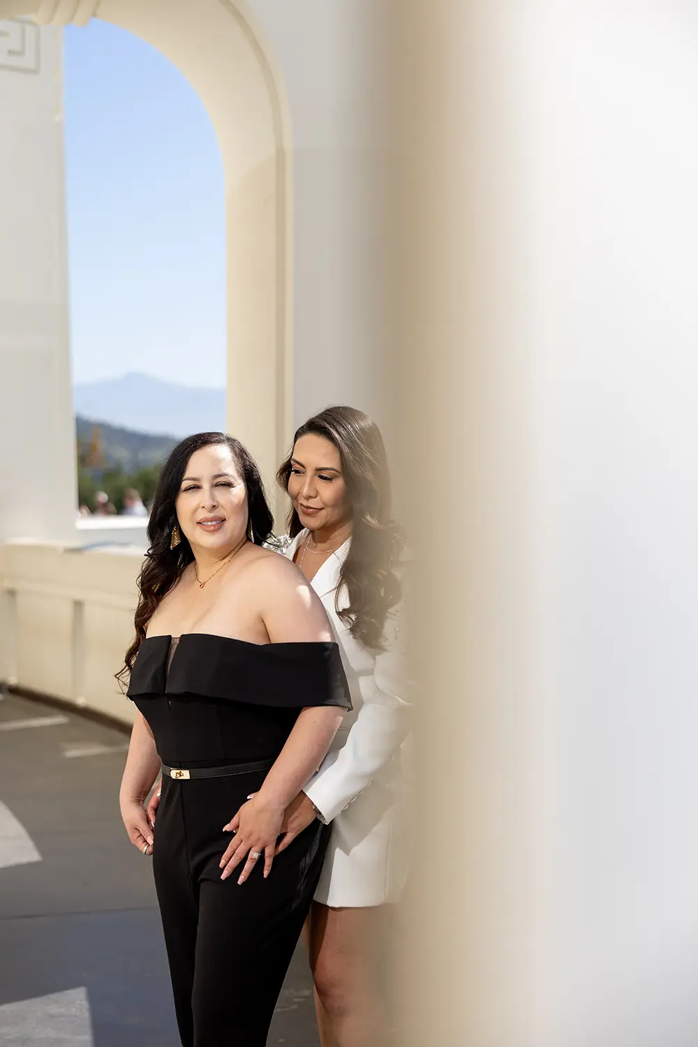 LGBT couple posing at the Griffith Park observatory during engagement photo session NZ WEDDING STUDIO Los Angeles Wedding Photographer