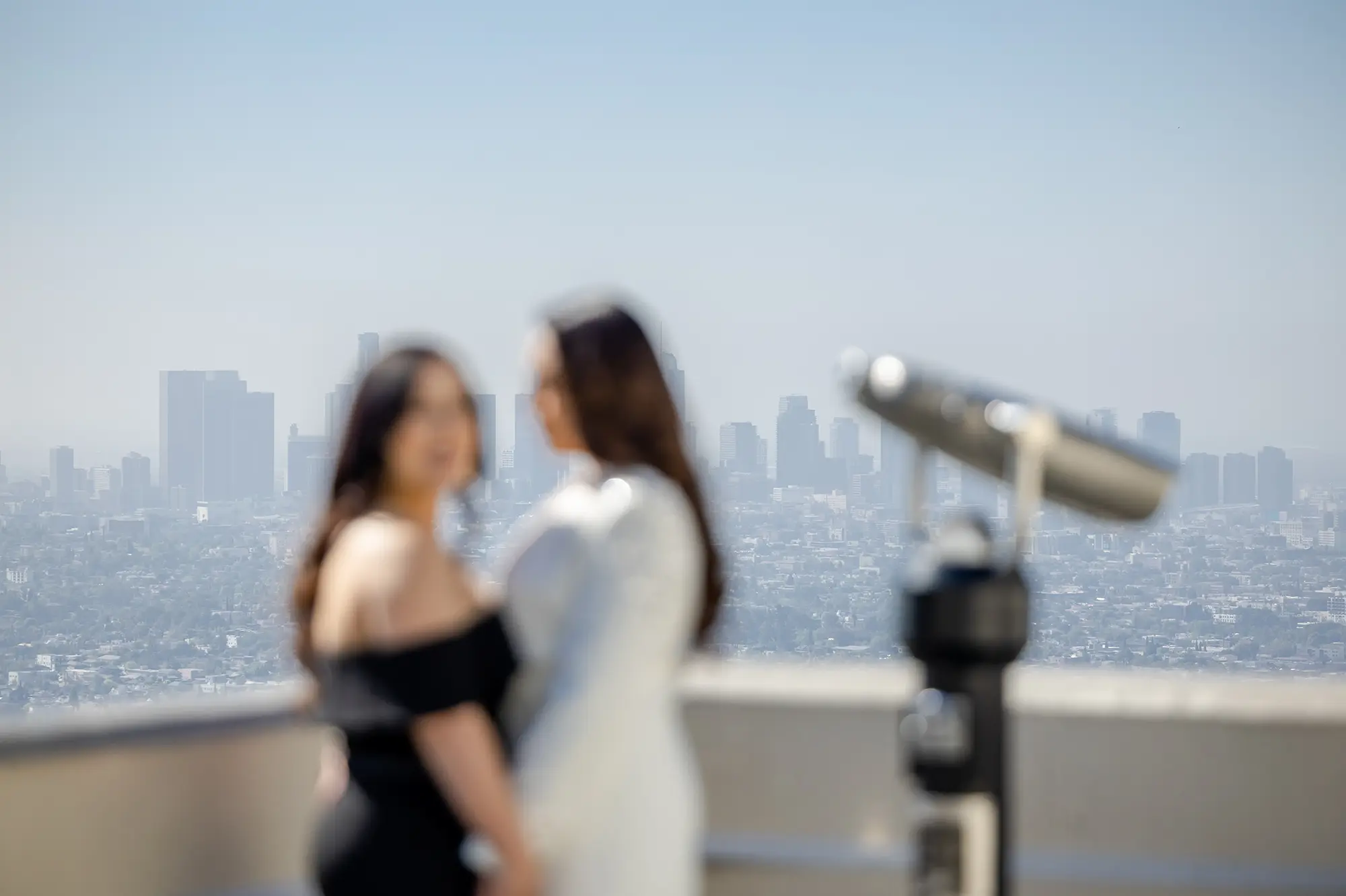 LGBT couple posing at the Griffith Park observatory during engagement photo session NZ WEDDING STUDIO Los Angeles Wedding Photographer