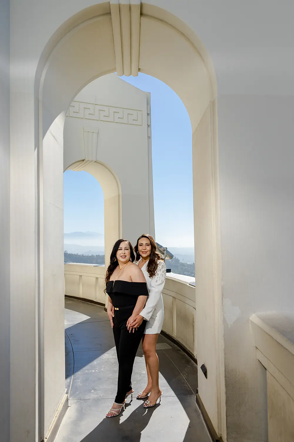 LGBT couple posing at the Griffith Park observatory during engagement photo session NZ WEDDING STUDIO Los Angeles Wedding Photographer